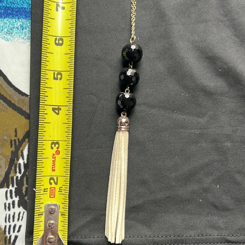 Long necklace. Black beads with ivory